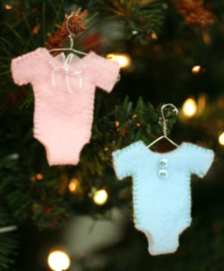 baby's first Christmas ornaments on the tree