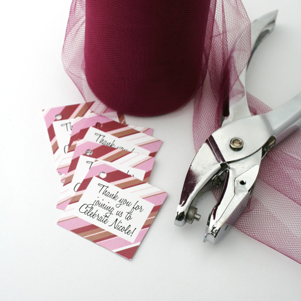 preparing tags and tulle making party favors
