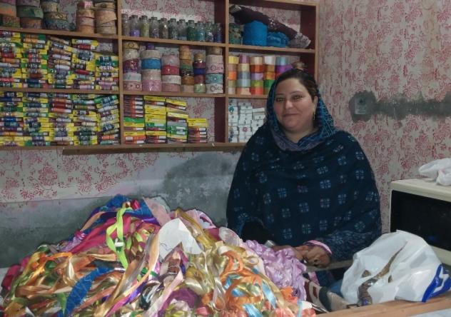 saima organizes her sewing supplies